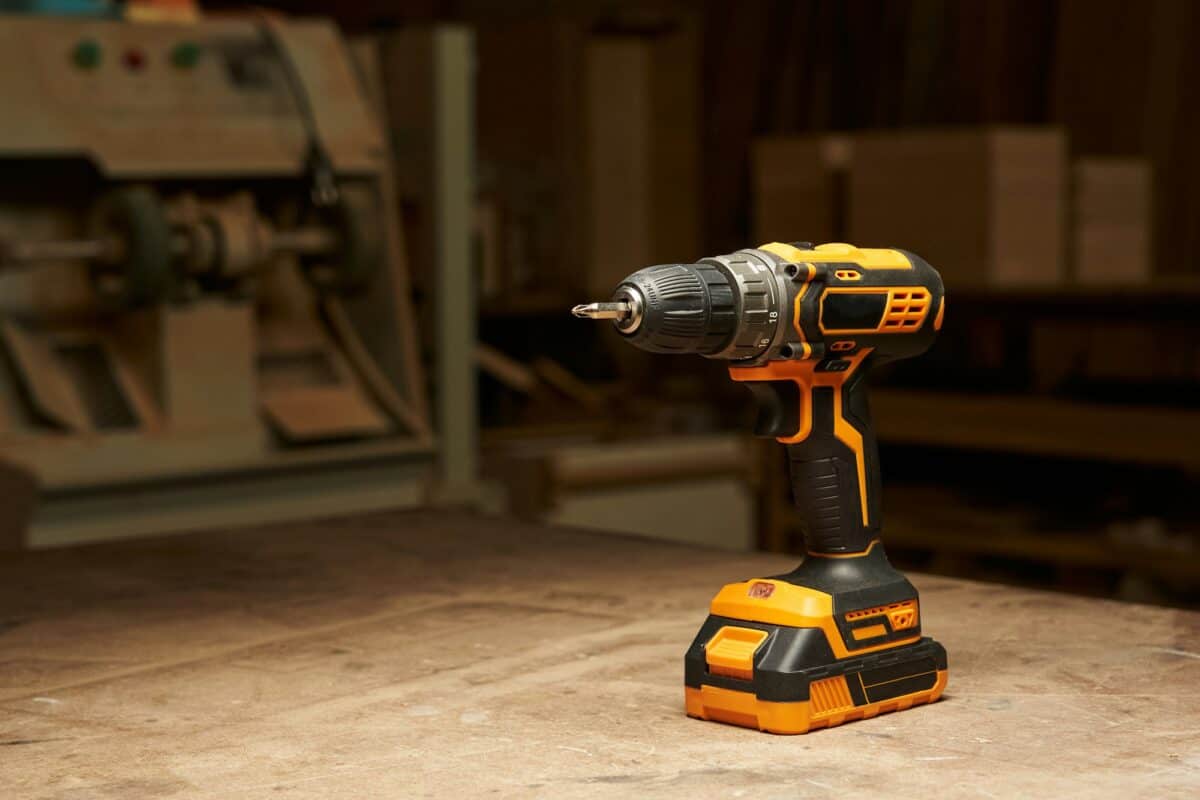 a beautiful black and yellow electric screwdriver with sharp corners with a replaceable battery