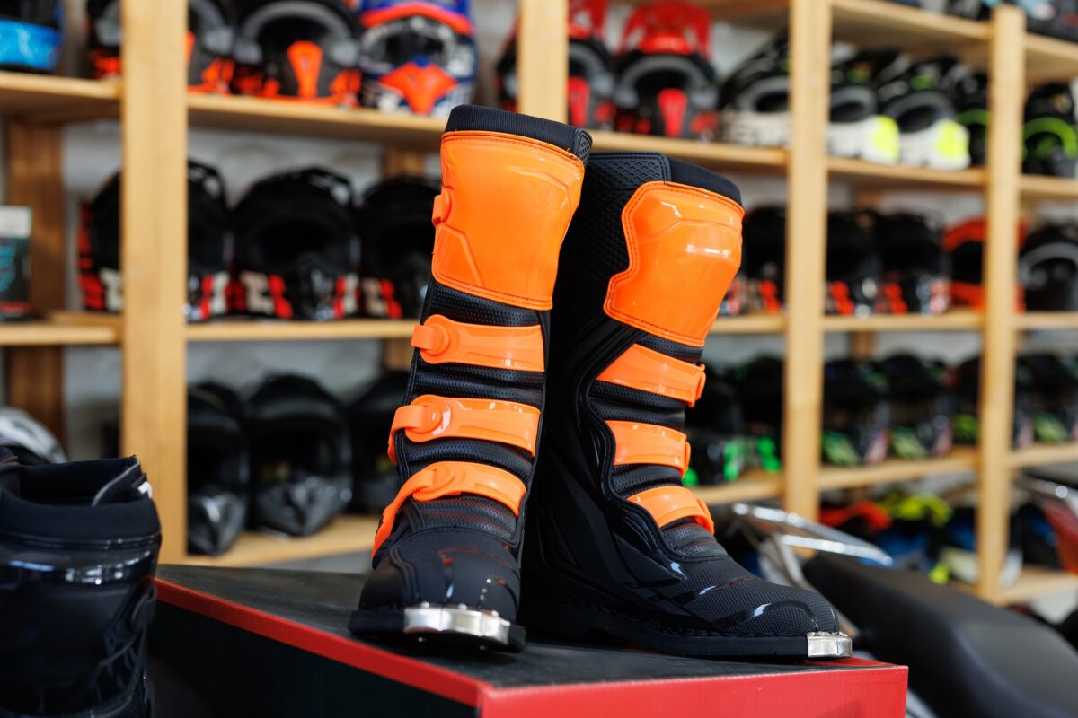 Motorcycle equipment in the form of boots in a motorcycle shop.