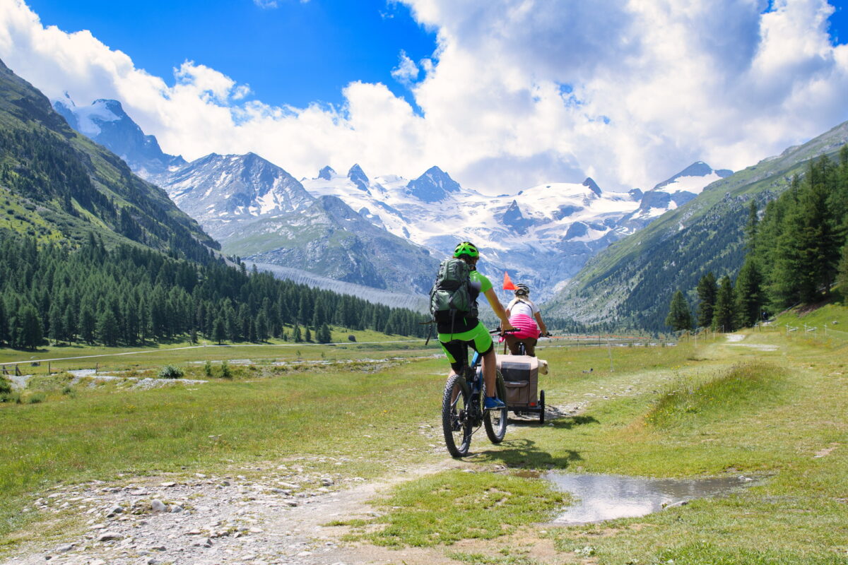 Family on bike tour with trailer for the child