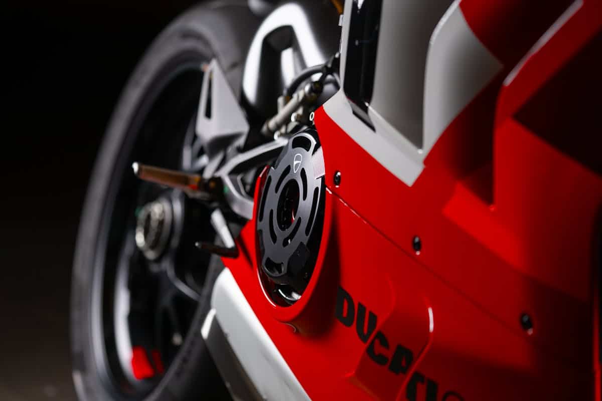 Detailed close-up of a red Ducati motorbike highlighting its design and style.