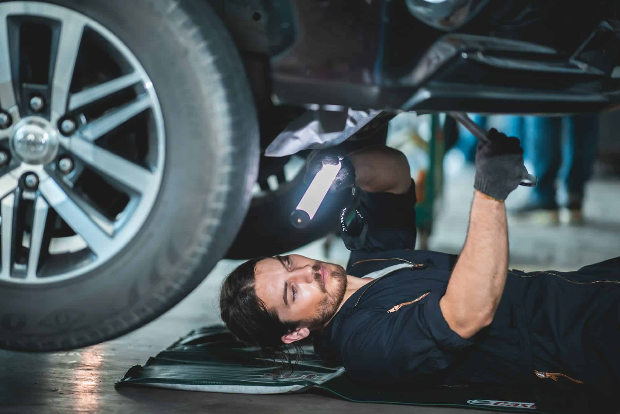 mechanic car service worker man technician are maintenance or repair vehicle car engine