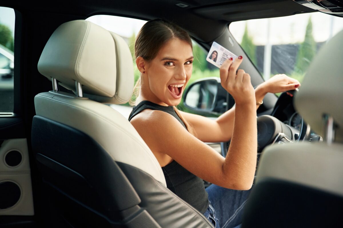 Got driver's license. Woman is sitting in the car