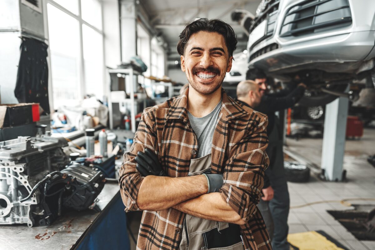 Portrait of a male mechanic in an auto repair shop