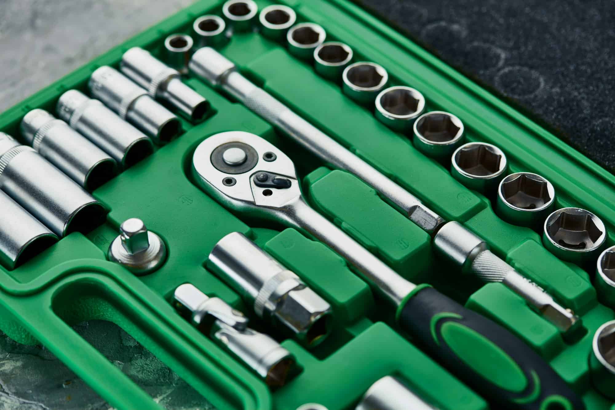 Set of spanners with ratchet in green toolbox