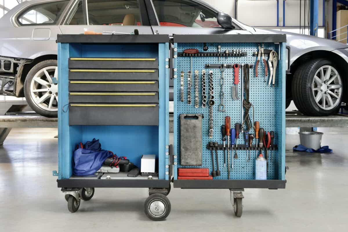 Tools on a trolley,organised in rows,at an auto repair shop.