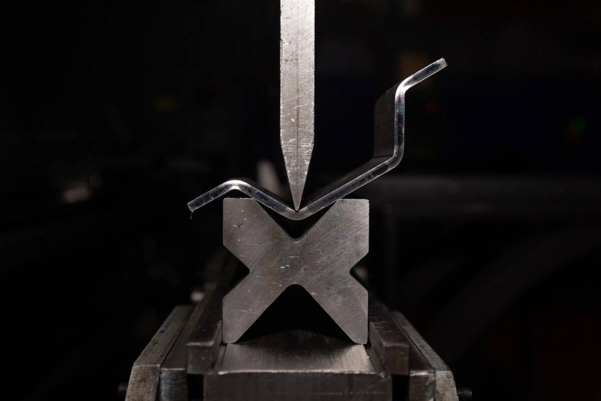 working with sheet metal on CNC hydraulic press brake. Bending sheet metal