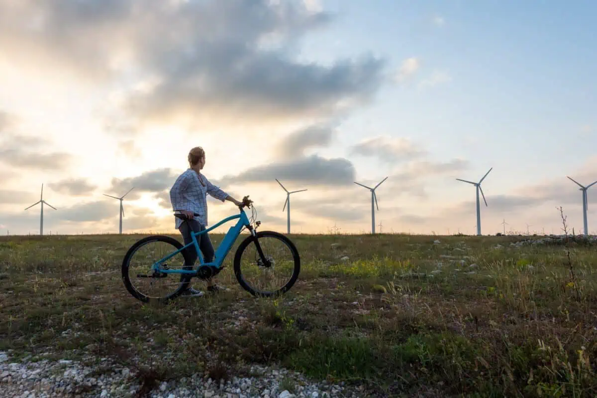 Woman with a bike in the nature
